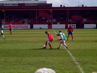 Pratt shielding the ball from Peter Garland